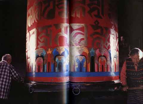 
Pilgrims turning large prayer wheel - Tibetan Buddhist Life book
